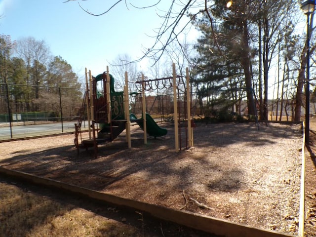 view of playground with tennis court