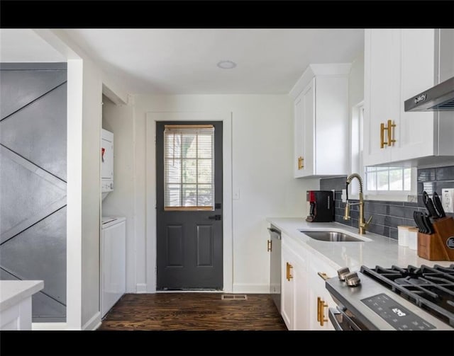 kitchen featuring tasteful backsplash, wall chimney range hood, sink, white cabinets, and dark hardwood / wood-style floors