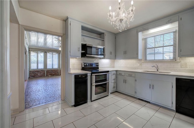 kitchen with a sink, stainless steel appliances, plenty of natural light, and light countertops