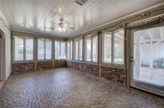 unfurnished sunroom featuring visible vents, wood ceiling, and a healthy amount of sunlight