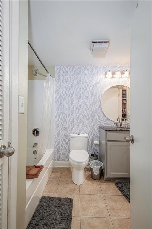 full bathroom with toilet, vanity, shower / tub combo with curtain, and tile patterned flooring