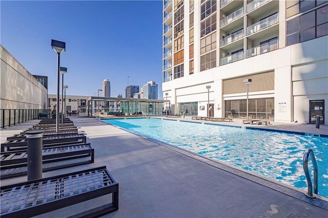 view of swimming pool with a patio