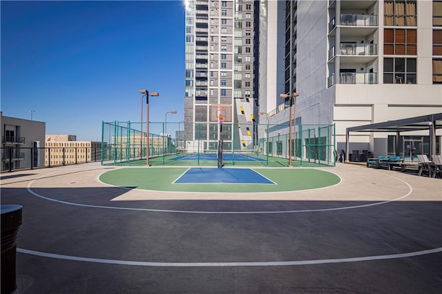 view of sport court featuring tennis court