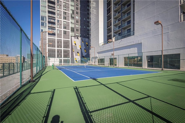 view of sport court featuring basketball hoop