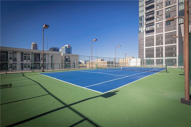 view of sport court with basketball hoop