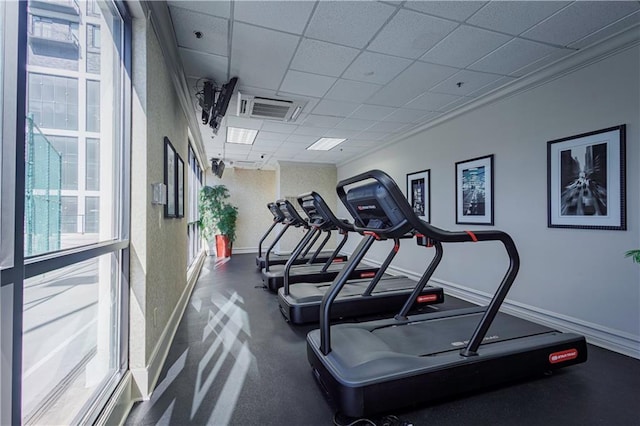 gym featuring a drop ceiling