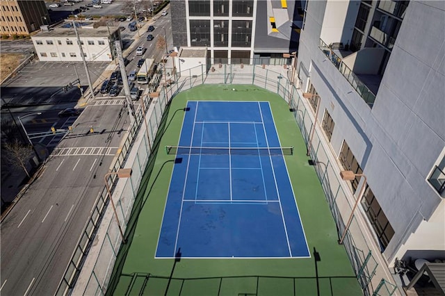 view of sport court featuring basketball hoop