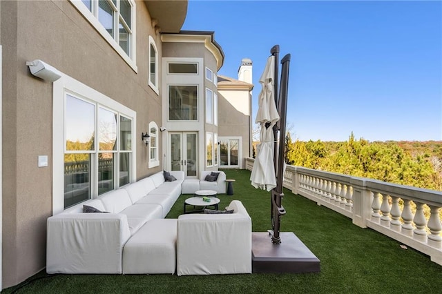 exterior space with a yard, french doors, and an outdoor hangout area