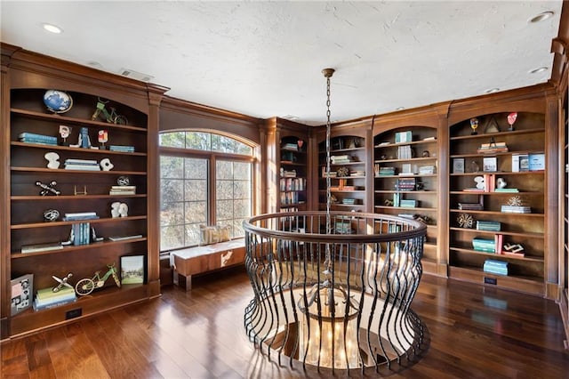 living area featuring dark hardwood / wood-style floors and ornamental molding