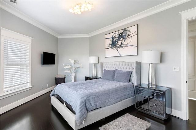 bedroom with dark hardwood / wood-style flooring and crown molding