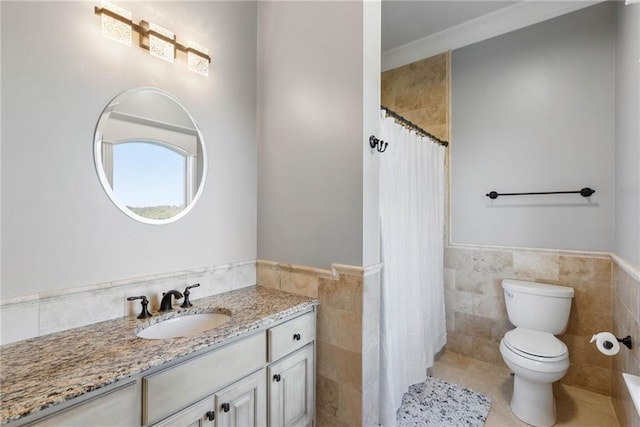 bathroom featuring vanity, tile patterned flooring, a shower with shower curtain, toilet, and tile walls