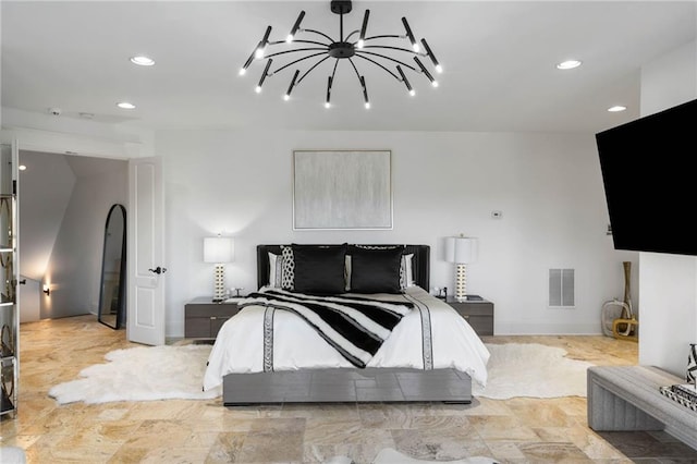 bedroom featuring an inviting chandelier