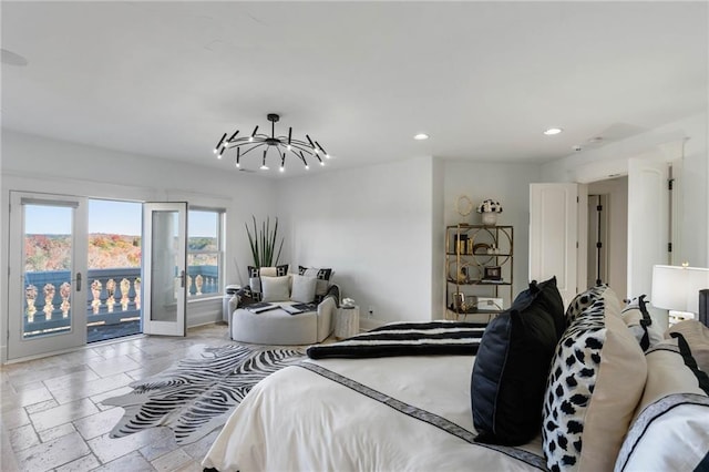 bedroom featuring an inviting chandelier, access to exterior, and french doors