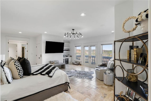 bedroom featuring access to exterior and french doors