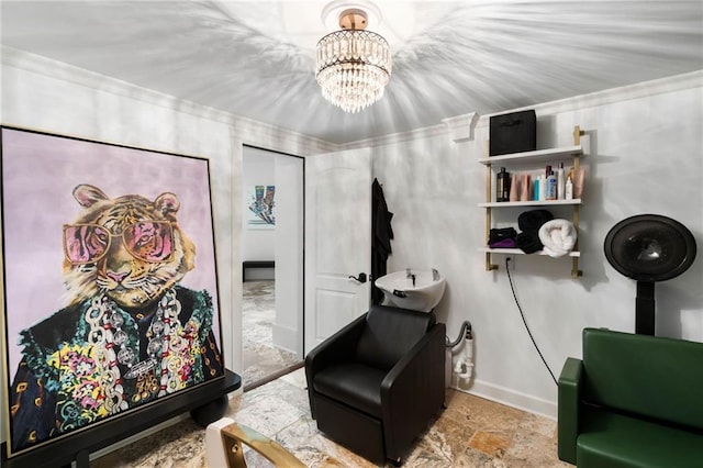 living area featuring a chandelier and crown molding