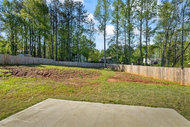 view of yard featuring a patio area and fence