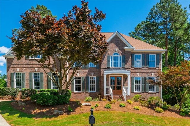 1096 Bridge Mill Ave, Canton, GA 30114 - colonial inspired home featuring french doors, brick siding, and a front lawn