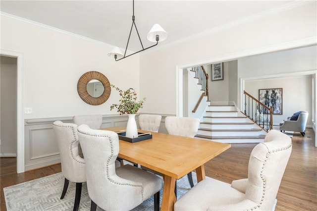 1096 Bridge Mill Ave, Canton, GA 30114 - dining space featuring stairway, crown molding, light wood-type flooring, a chandelier, and wainscoting