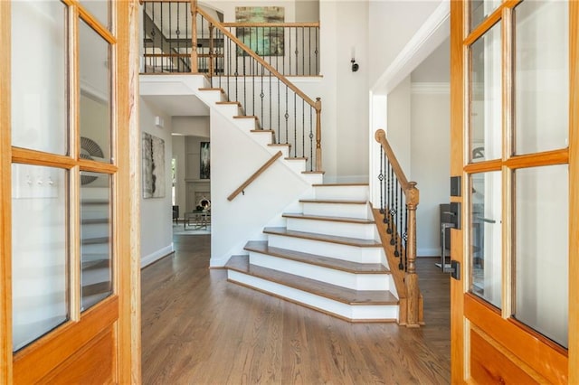 1096 Bridge Mill Ave, Canton, GA 30114 - foyer entrance featuring baseboards, wood finished floors, a high ceiling, and stairs