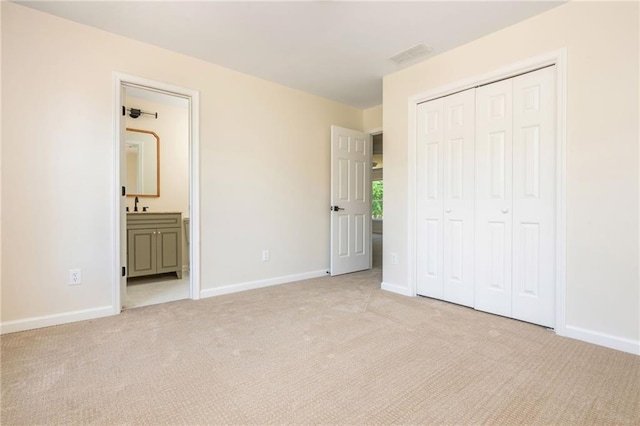 1096 Bridge Mill Ave, Canton, GA 30114 - unfurnished bedroom with light carpet, baseboards, a closet, a sink, and ensuite bath