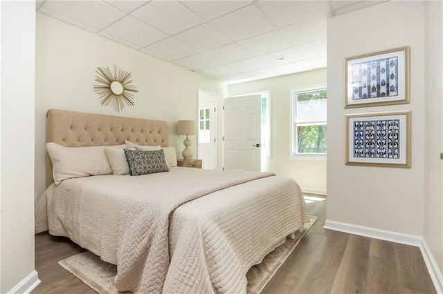1096 Bridge Mill Ave, Canton, GA 30114 - bedroom featuring a drop ceiling, wood finished floors, and baseboards