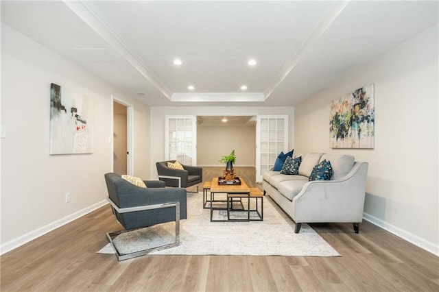 1096 Bridge Mill Ave, Canton, GA 30114 - living room featuring wood finished floors, baseboards, a raised ceiling, recessed lighting, and ornamental molding