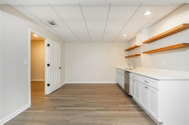 1096 Bridge Mill Ave, Canton, GA 30114 - indoor wet bar featuring stainless steel dishwasher, a drop ceiling, baseboards, light wood-type flooring, and recessed lighting