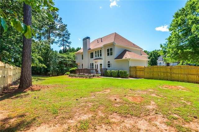 1096 Bridge Mill Ave, Canton, GA 30114 - back of property featuring a chimney and a wooden deck