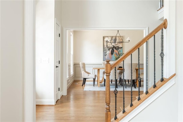 1096 Bridge Mill Ave, Canton, GA 30114 - staircase featuring wood finished floors, a chandelier, and baseboards