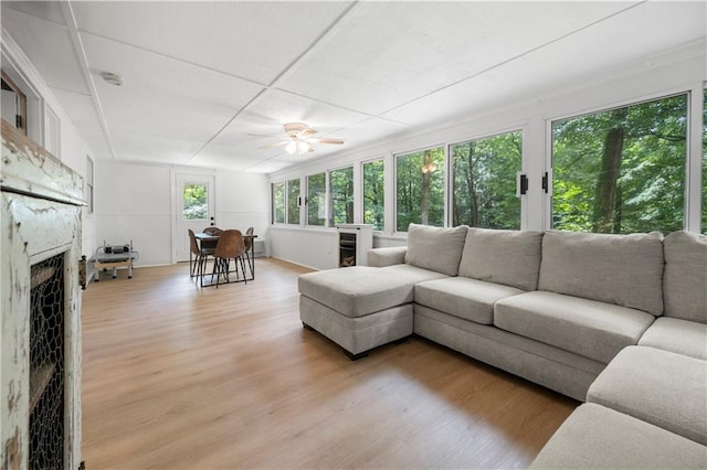 1104 Warrenhall Ln NE, Brookhaven, GA 30319 - living room with light wood finished floors, a fireplace, and a ceiling fan