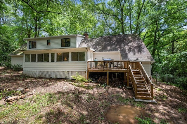 1104 Warrenhall Ln NE, Brookhaven, GA 30319 - rear view of house featuring stairs, a wooden deck, a chimney, and a sunroom
