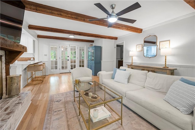1104 Warrenhall Ln NE, Brookhaven, GA 30319 - living area with french doors, ceiling fan, a wainscoted wall, light wood-type flooring, and beamed ceiling