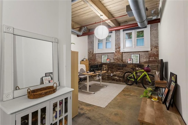 19 Hilliard St SE Unit 13, Atlanta, GA 30312 - miscellaneous room with brick wall, concrete floors, and wooden ceiling with exposed beams