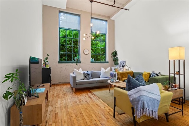 19 Hilliard St SE Unit 13, Atlanta, GA 30312 - living room featuring light wood finished floors and a chandelier