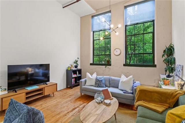 19 Hilliard St SE Unit 13, Atlanta, GA 30312 - living room featuring wood finished floors and a chandelier