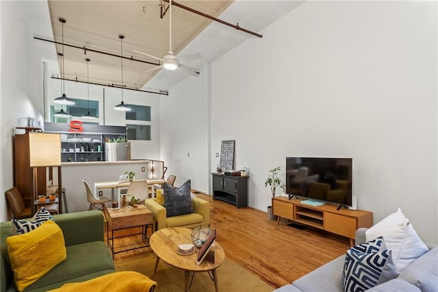 19 Hilliard St SE Unit 13, Atlanta, GA 30312 - living room featuring wood finished floors, a ceiling fan, and a high ceiling