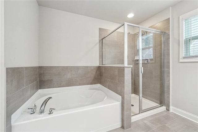 791 Belrose Dr, Smyrna, GA 30080 - bathroom featuring a garden tub, a stall shower, baseboards, and tile patterned flooring