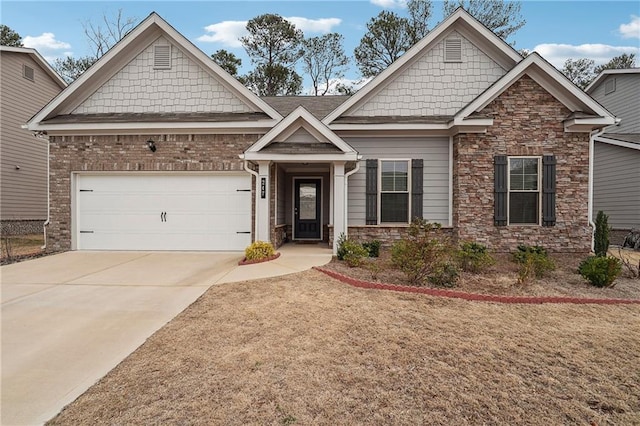 craftsman inspired home featuring an attached garage and concrete driveway