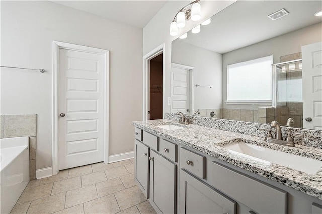 full bath with a garden tub, a stall shower, a sink, and visible vents