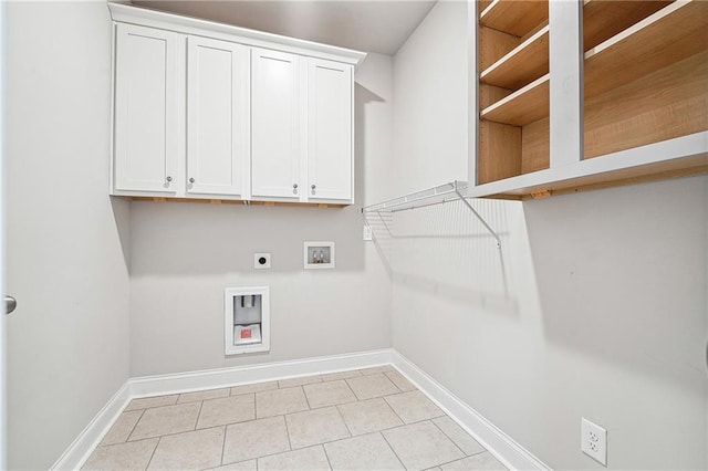 laundry area featuring washer hookup, hookup for an electric dryer, baseboards, and light tile patterned floors