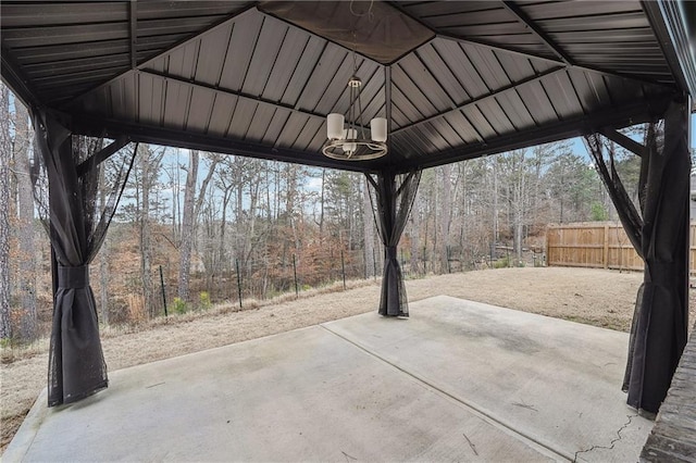 view of patio featuring fence