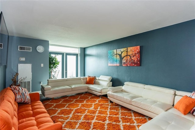 living area featuring a textured wall