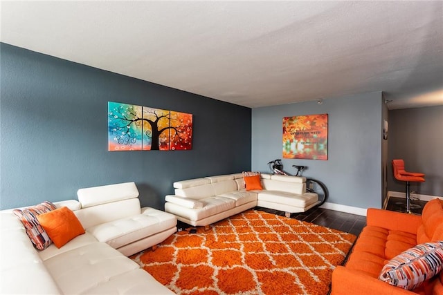 living room with wood finished floors and baseboards