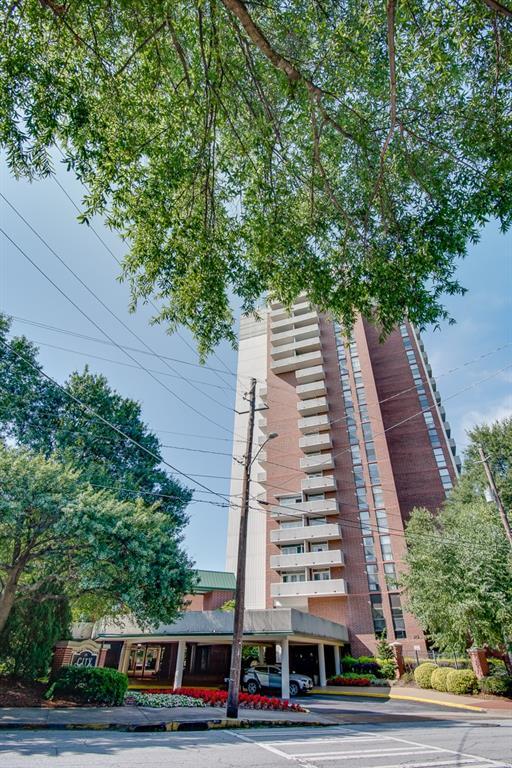 view of property featuring uncovered parking