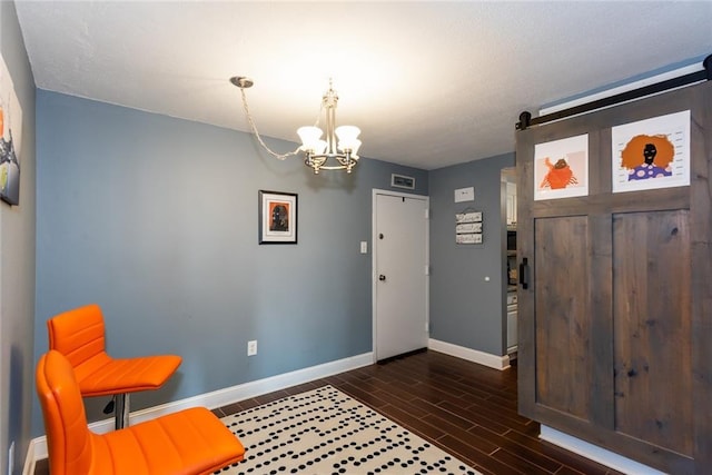 entryway featuring a chandelier, baseboards, and dark wood-style floors