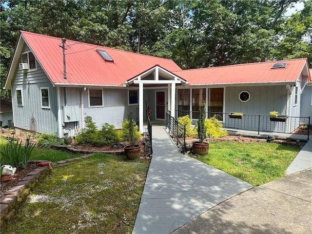 226 Hawk Hill Ln, Lakemont, GA 30552 - view of front of home with covered porch, a front lawn, and metal roof