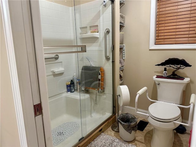 226 Hawk Hill Ln, Lakemont, GA 30552 - bathroom featuring toilet, a stall shower, and baseboards