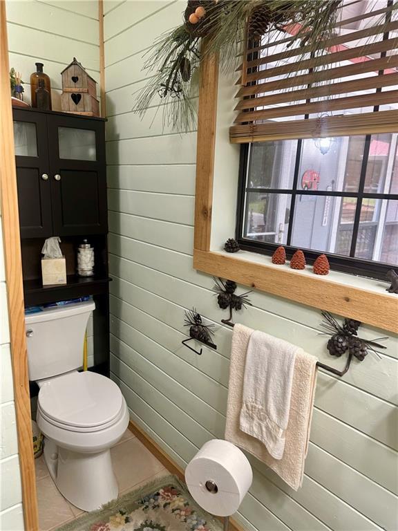 226 Hawk Hill Ln, Lakemont, GA 30552 - bathroom featuring toilet, wooden walls, and tile patterned flooring