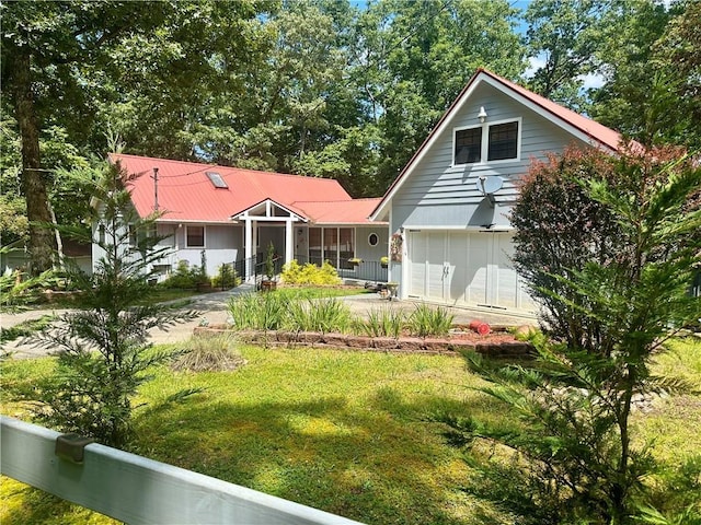 226 Hawk Hill Ln, Lakemont, GA 30552 - back of property with concrete driveway, metal roof, and a yard