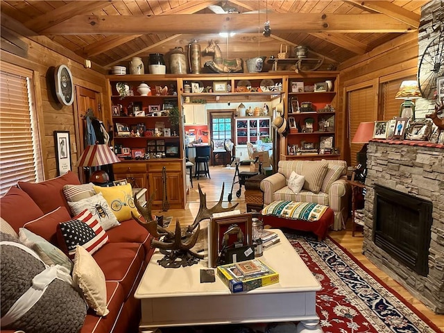226 Hawk Hill Ln, Lakemont, GA 30552 - living area with wooden ceiling, wooden walls, light wood-style floors, and a fireplace